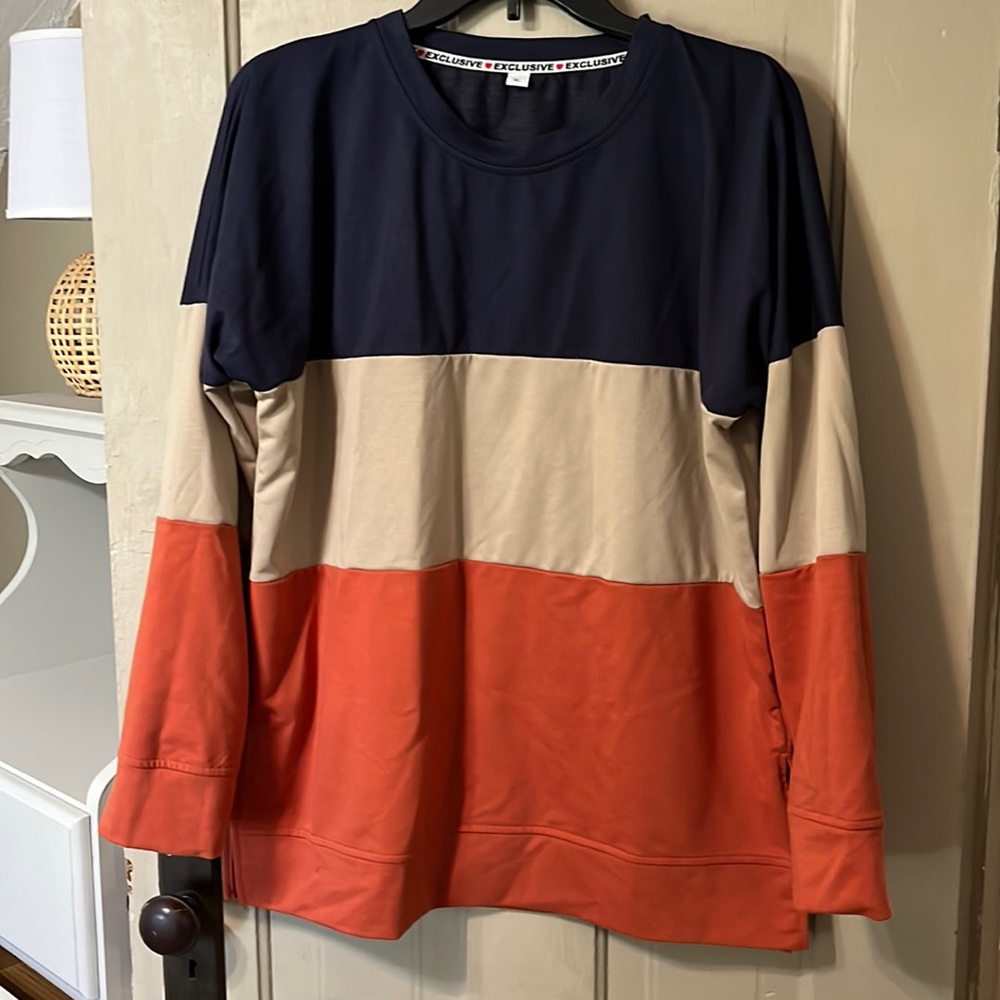 Long sleeve color block shirt. New without tags.